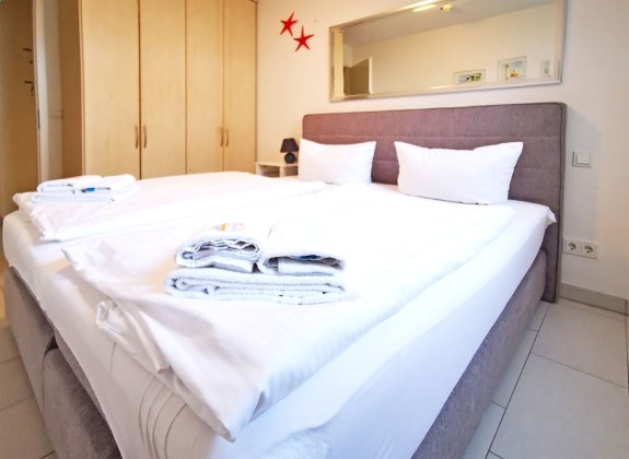 Schlafzimmer  Ferienwohnung Sanddornstübchen mit Meerblick Ref. 128662-T