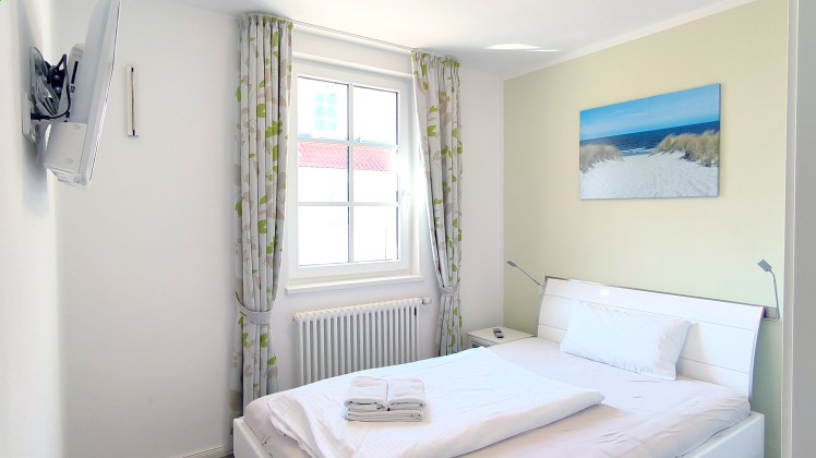 Schlafzimmer 1 Ferienwohnung Seebrise, teilweise Meerblick Ref. 130579-1